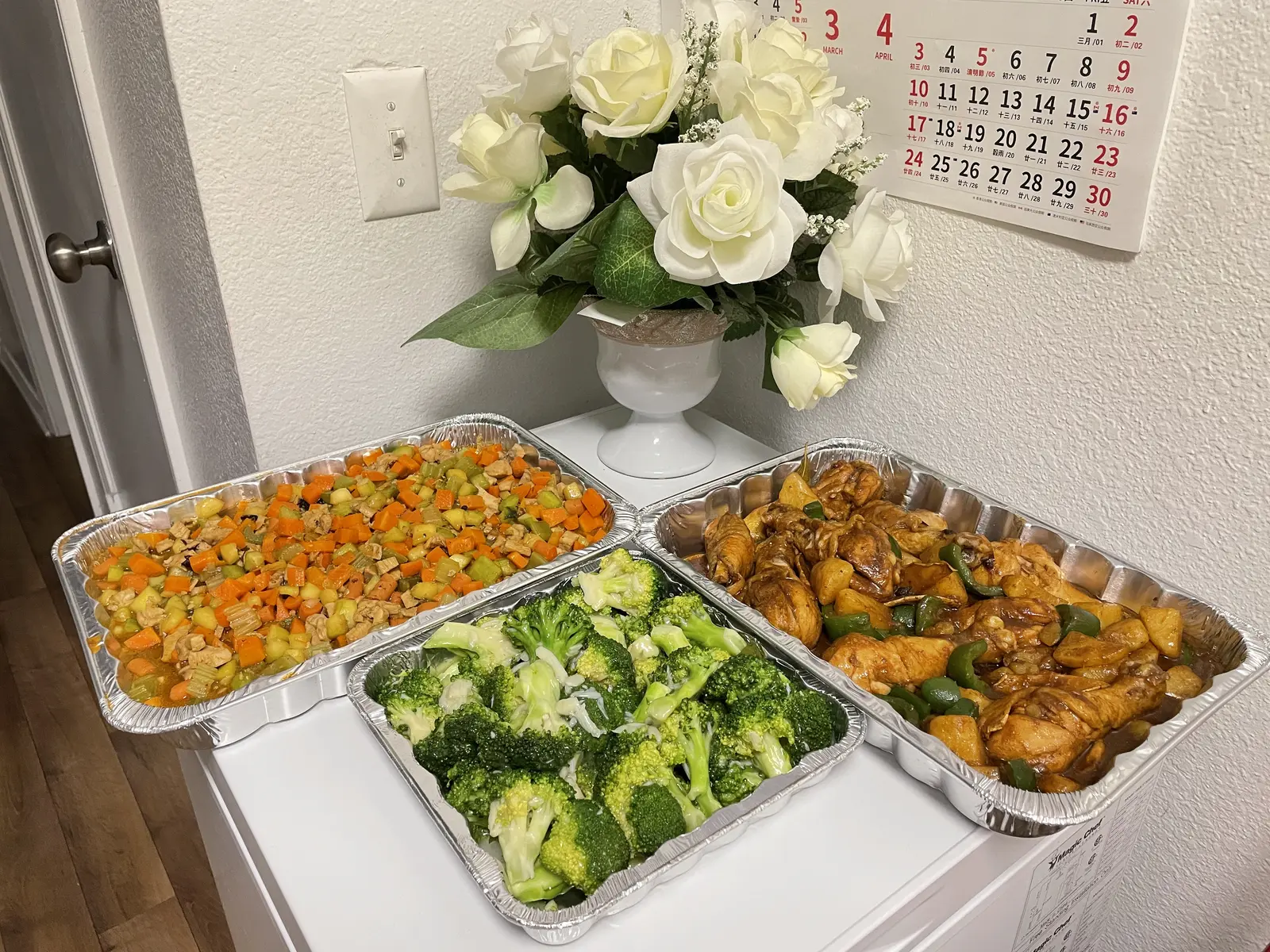 A colorful balanced meal with broccoli, vegetables, chicken, and potatoes