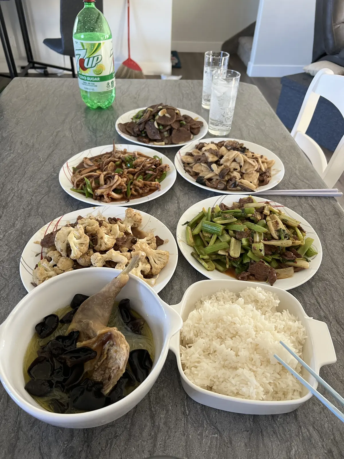 Balanced Chinese meal with vegetables, soup, protein, and rice