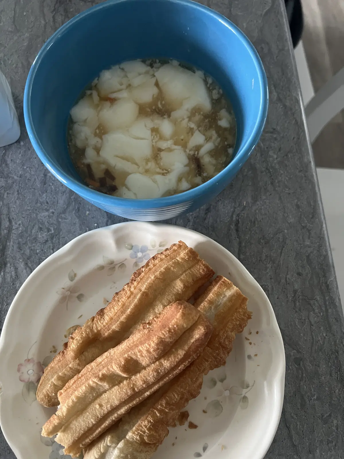 Chinese breakfast with tofu pudding and youtiao