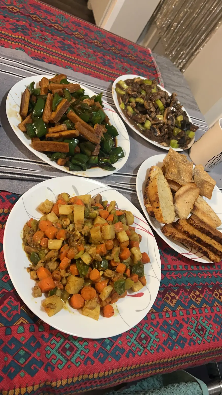 Family-style Chinese lunch with vegetables, tofu, and meat dishes